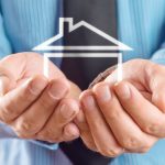 House In Hands Of Businessman